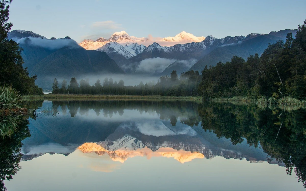 Mirror reflections of Aoraki and Mount Tasman in Lake Matheson