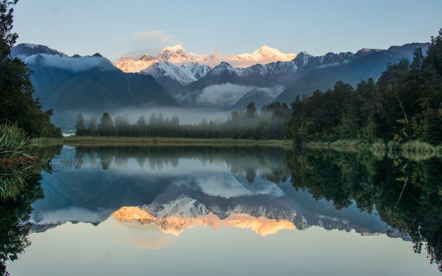 Mirror reflections of Aoraki and Mount Tasman in Lake Matheson